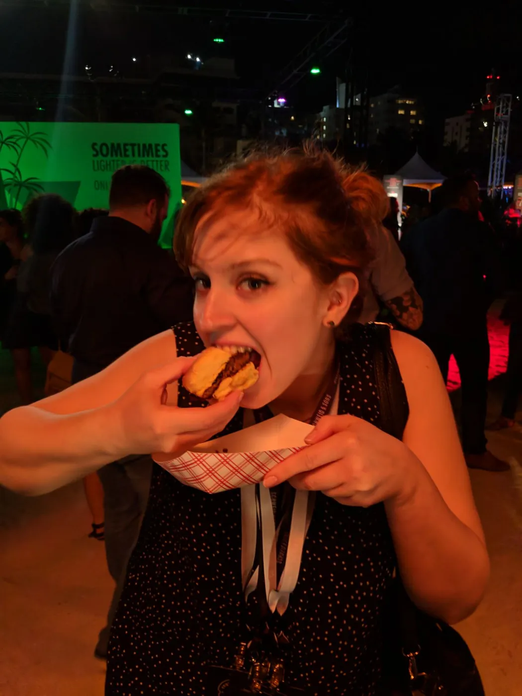 Guest biting into a frita at the Burger Bash