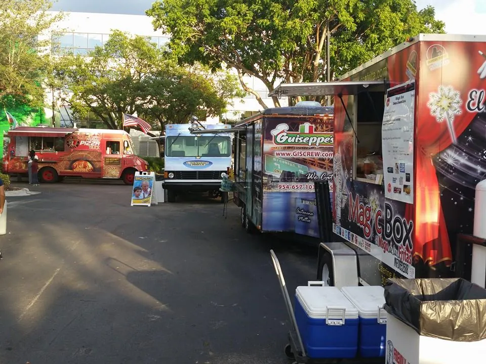 Magic Box lined up with other food trucks at a South Florida rally